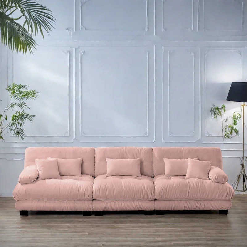Sofa für vier Personen mit runden Armlehnen und tiefen Sitzkissen