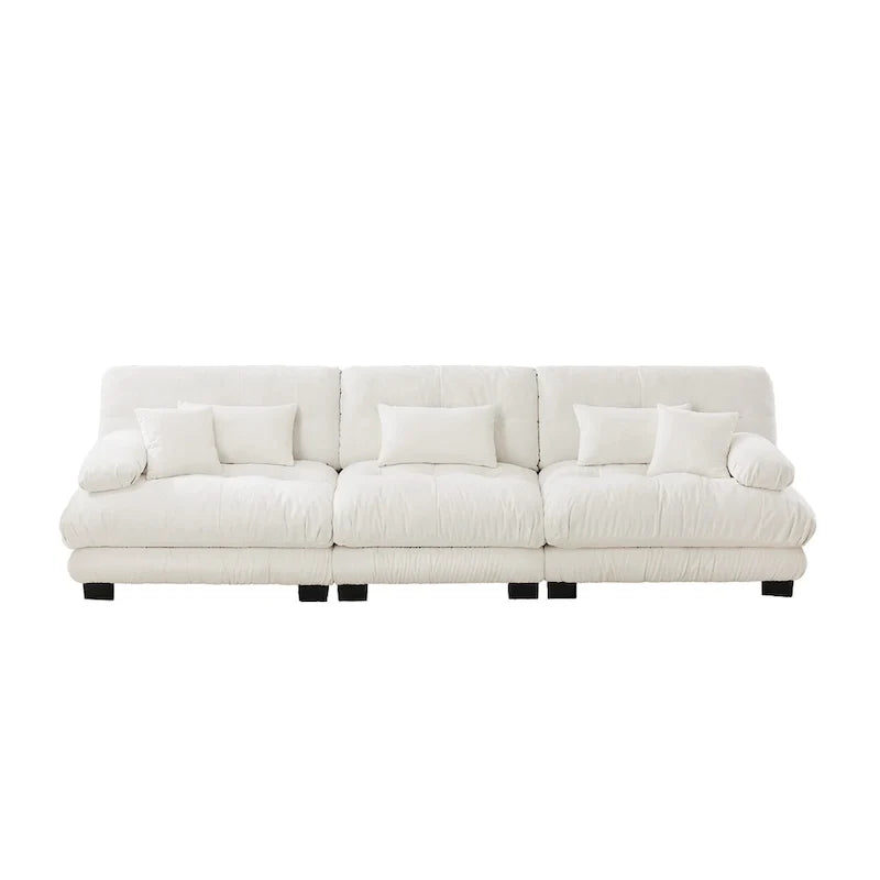 Sofa für vier Personen mit runden Armlehnen und tiefen Sitzkissen