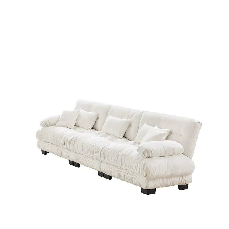Sofa für vier Personen mit runden Armlehnen und tiefen Sitzkissen
